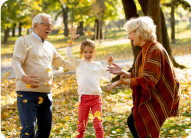 grandparents-enjoying-good-time-with-their-cute-little-granddaughter (1)